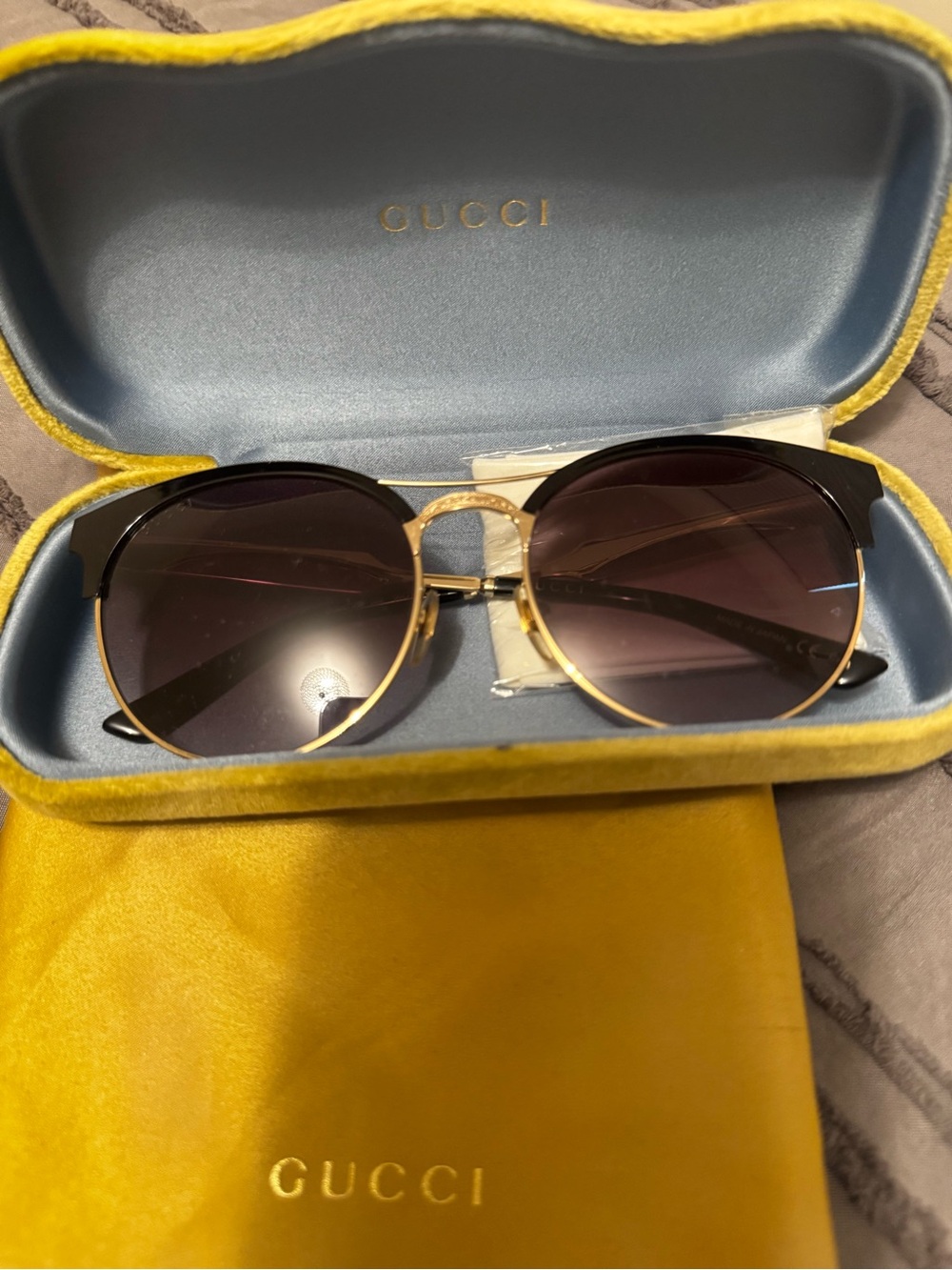 Gucci Women’s Black and Gold Round Sunglasses with Gradient Lenses